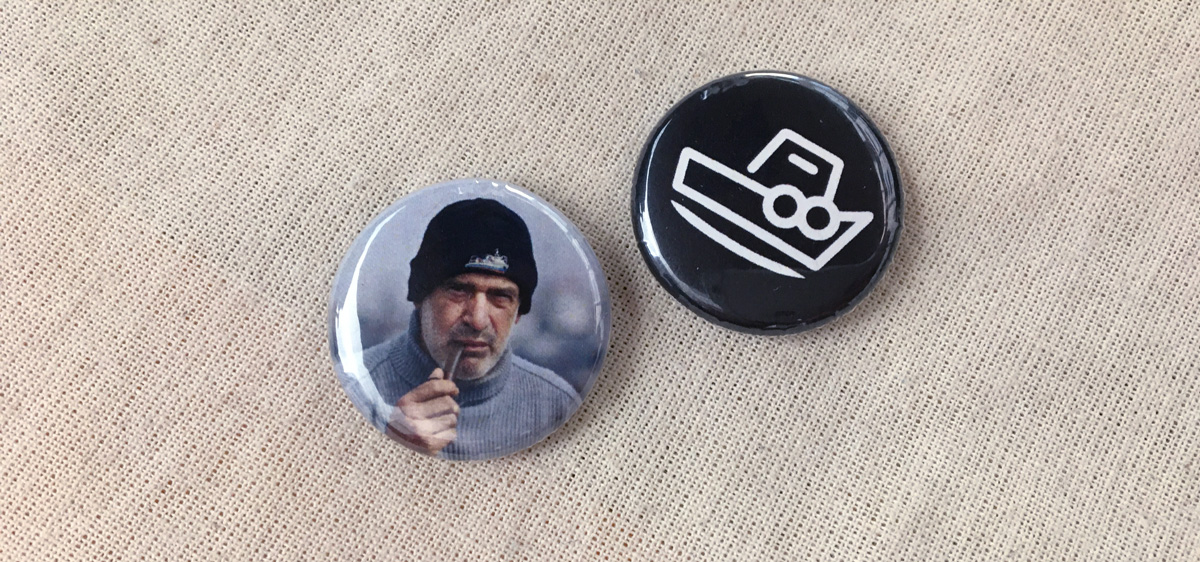 two small buttons, one with a tugboat captain photo, one with a tugboat icon